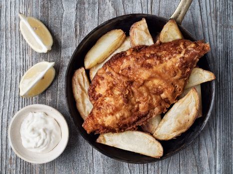 close up of rustic traditional english fish and chips