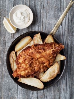 close up of rustic traditional english fish and chips