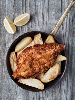 close up of rustic traditional english fish and chips