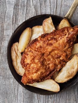 close up of rustic traditional english fish and chips