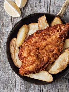 close up of rustic traditional english fish and chips