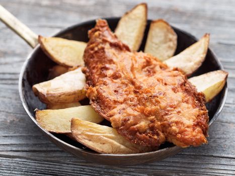 close up of rustic traditional english fish and chips