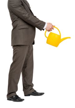 Businessman with watering-can and without head on isolated white background