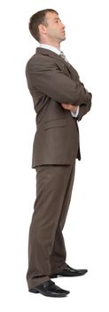 Businessman standing on isolated white background, side view