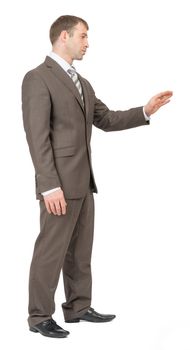 Businessman standing on isolated white background, side view