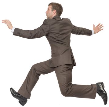 Businessman in suit running on isolated white background