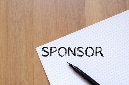 Sponsor text concept write on notebook with pen
