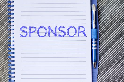 Sponsor text concept write on notebook with pen