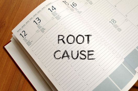 Roor cause text concept write on notebook with pen