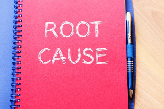 Roor cause text concept write on notebook with pen