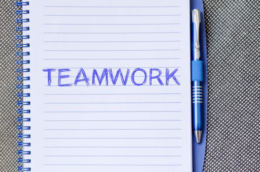 Teamwork text concept write on notebook with pen