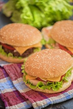 Closeup of home made burgers on wooden table