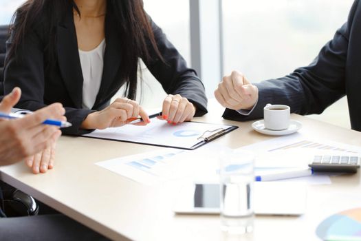 Business people discussing financial reports during a meeting