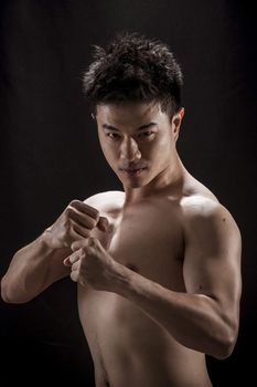 Topless portrait of Asian young man - Fighter concept, Muaythai, boxing