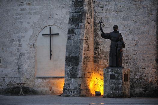 Havana, Cuba, August 2013.  Statue of St Francis of Assisi and small boy, Plaza de San Francisco in Old Habana.