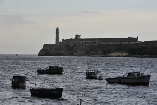 Havana, Cuba, - August 2013. Havana Harbor is the port of Havana, the capital of Cuba, and it is the main port in Cuba. Across the bay the castle of Morro can be seen.and it is the main port in Cuba. Across the bay the castle of Morro cam be seen.