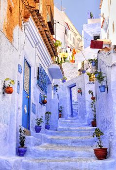 Street with stairs in medina of moroccan blue town Chefchaouen