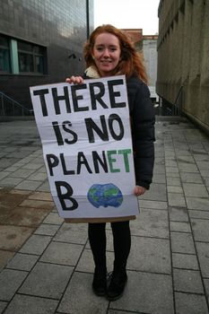 UK, Newcastle upon Tyne: A protester shows off her sign as hundreds more rally in Newcastle upon Tyne, UK on November 29, 2015, joining activists in major cities across the world for a Global Climate March. Participants aim to put pressure on world leaders to come to an agreement on preserving the environment at the upcoming United Nations Climate Summit, which begins November 30 in Paris. 