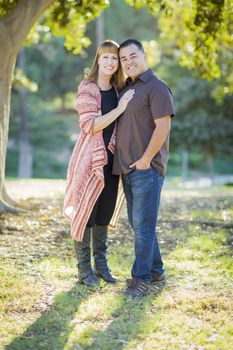 Young Loving Mixed Race Couple Portrait Outdoors.