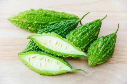 Bitter melon on wooden background.