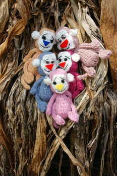2016, year of monkey, symbol of intelligent, lucky, agile, group of handmade monkey at oudoor, knitted toy as stuffed animal make from yarn,  hand made product on dark background
