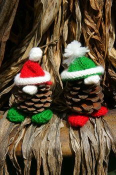 Christmas pine gnome, Xmas pinecone wear Xmas hat for decoration on winter holiday, with red, green yarn, homemade product by knitted hat, food, nose make amazing and pretty gift