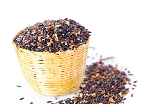 Thai black jasmine rice (Rice berry) in weave basket.