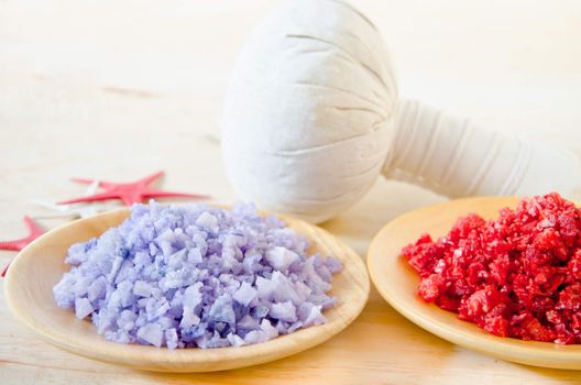 Salt Spa and Thai herbal compress for spa on wooden background.