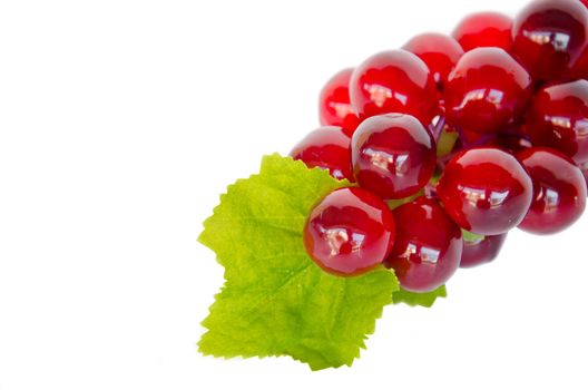 Red grape with leaf on white background