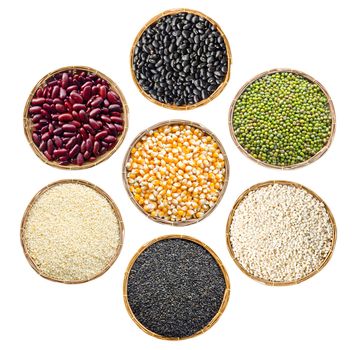 set of cereals seeds beans, red beans, black beans, green beans, sesame, black sesame, barley grit, in weave basket on white background.