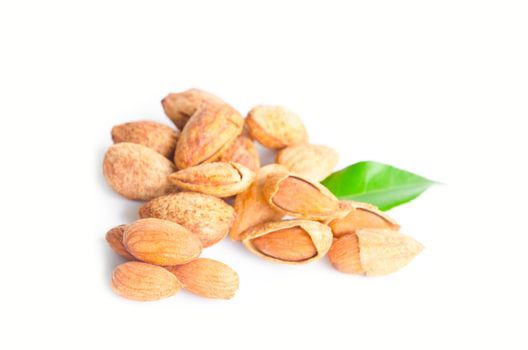 Almond with leaves isolated on white background
