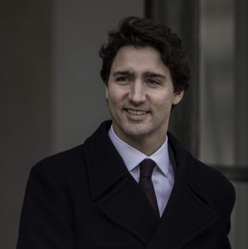 FRANCE, Paris : Canada's Prime minister Justin Trudeau shakes hands with France's President Fran�ois Hollande on November 29, 2015 at the Elysee palace in Paris. Some 150 leaders including will attend the start on November 30 of the UN conference on climate change, tasked with reaching the first truly universal climate pact.