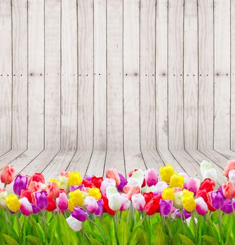 Bouquet tulip flowers on wooden wallpaper background.