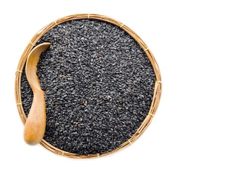 poppy seeds in weave basket on white background.
