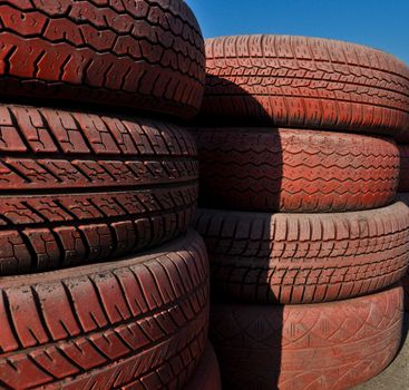 close up of racetrack fence of  red old tires