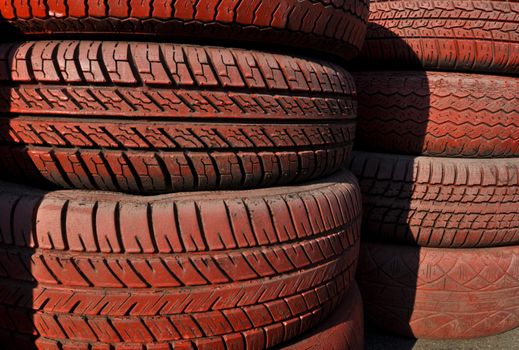 close up of racetrack fence of  red old tires