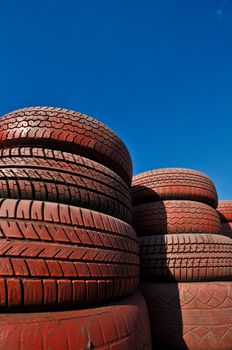 close up of racetrack fence of  red old tires