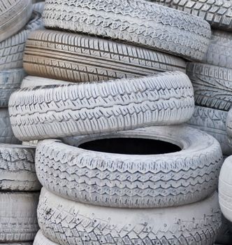 close-up. the white automobile tires dumped in a a big pile