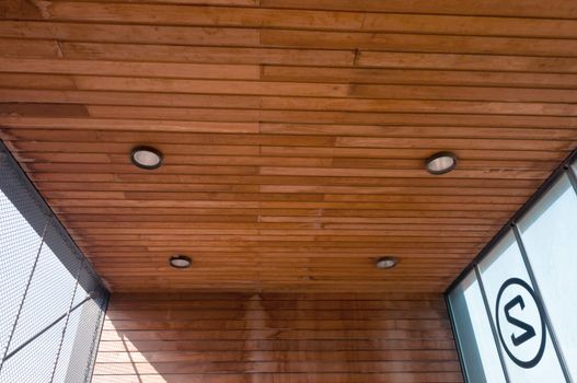 wooden ceiling with round lights