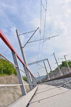 railroad track, embankment, and power poles