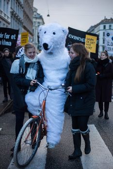 DENMARK, Copenhagen: A man dressed up as a polar bear rides a bike as thousands attend a 'march for climate' in Copenhagen, on November 29, 2015, called by NGOs ahead of the UN climate summit COP21 in Paris.