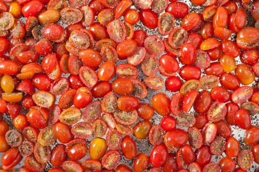 Cherry tomatoes with herbs preparing for dry out with sun light