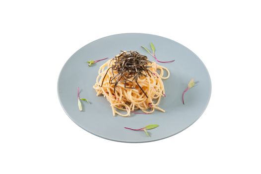 Pasta with Mentaiko (Cod fish's roe) sauce, Japanese food in European style isolated on white background with clipping path