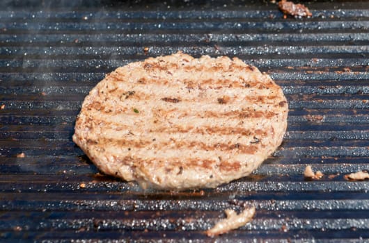 succulent grilled steak on a hot grill