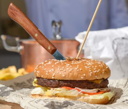 hamburger with a knife stuck in it