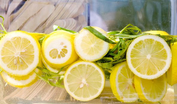 cold fresh lemonade with slices of lemon closeup