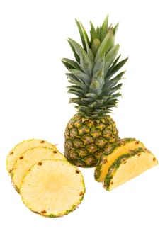Pineapple with slices on a white background