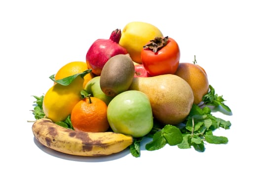 a lot of different fruits and green leaves on white background