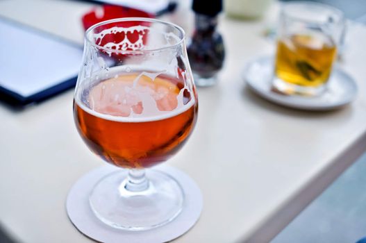 beer with the foam in a glass goblet