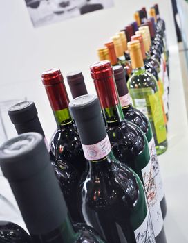 bottles with wine stand on a display